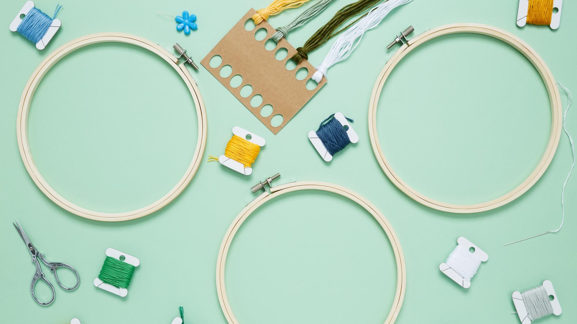 Workshop table with embroidery hoop and digital templates
